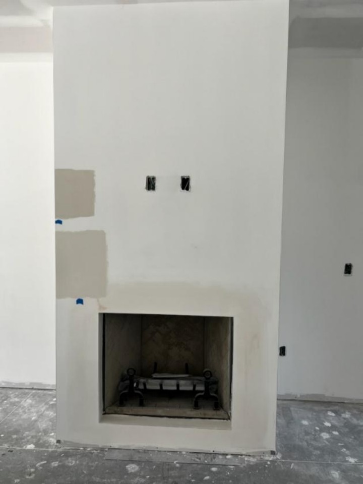 A fireplace under construction.